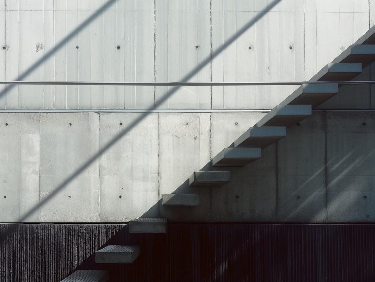 Concrete staircase with diagonal shadows